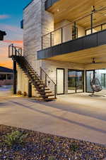 Entrance to property featuring a patio and a ceiling fan