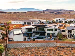 Rear view of house with a residential view and a mountain view