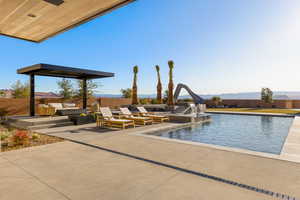 View of swimming pool with a patio, a mountain view, outdoor lounge area, fence, and a fenced in pool