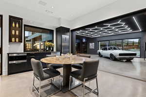 Dining room featuring concrete flooring