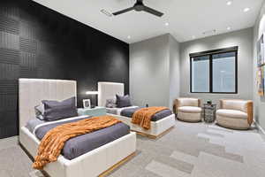 Bedroom featuring recessed lighting, light colored carpet, an accent wall, ceiling fan, and baseboards