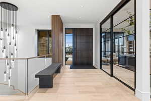 Entrance foyer featuring light wood finished floors