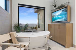 Full bathroom with a freestanding bath