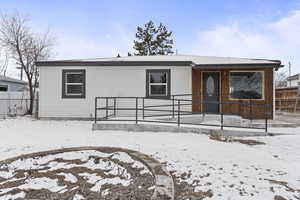 View of front of house with covered porch