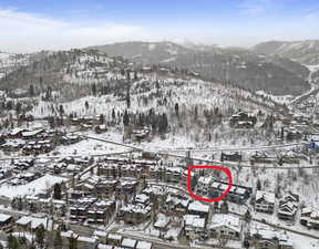 Snowy aerial view featuring a mountain view