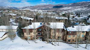 Snowy aerial view with a mountain view