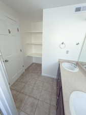 Bathroom featuring tile patterned floors and vanity