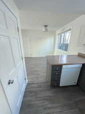 Kitchen featuring white dishwasher