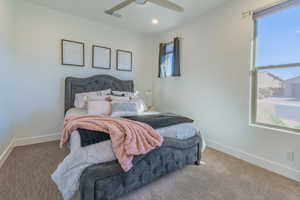 Bedroom featuring carpet floors and ceiling fan