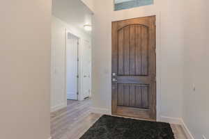 Entrance foyer featuring light wood-type flooring