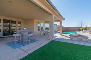 View of patio featuring a fenced in pool