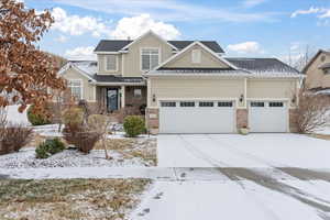 Craftsman inspired home featuring a garage