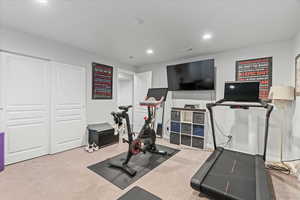 Workout room featuring carpet