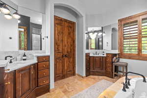 Bathroom featuring vanity and a bathtub