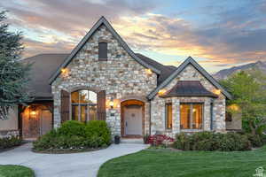 View of front of property with a yard