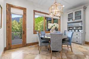 Dining room featuring a mountain view and a chandelier