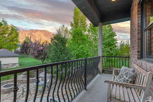 Balcony at dusk with a mountain view