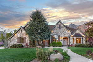 View of front of property with a yard and a mountain view