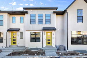 View of front of property featuring central AC