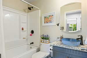 Full bathroom featuring vanity, toilet, and shower / bathing tub combination