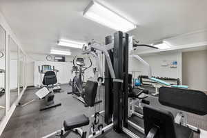 Workout area with a textured ceiling