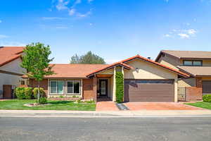 View of front of home featuring a garage