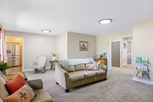 Living room featuring light carpet