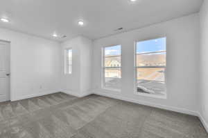 View of carpeted spare room