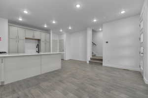 Kitchen with sink and light hardwood / wood-style floors