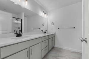 Bathroom with vanity and an enclosed shower