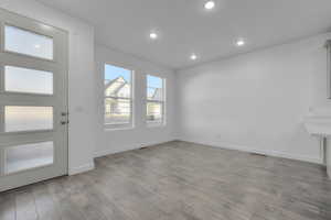 Foyer with light hardwood / wood-style flooring