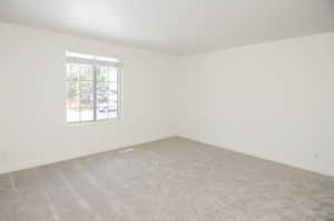 View of carpeted spare room