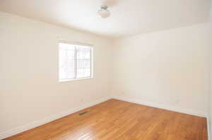 Spare room with light hardwood / wood-style floors