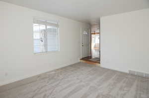 View of carpeted spare room