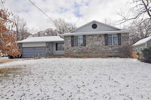 View of front of property with a garage