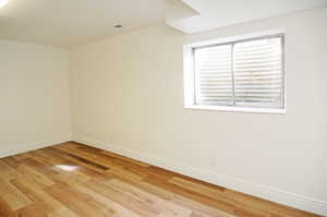 Spare room with light hardwood / wood-style floors