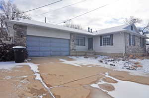 Single story home featuring a garage