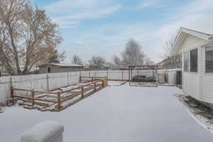 View of yard layered in snow