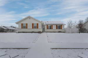 Ranch-style home with solar panels