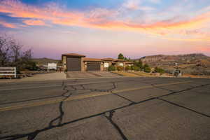 View of front of home featuring a mountain view and a garage