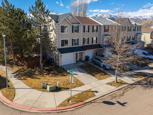 Townhome / multi-family property featuring a garage and a mountain view