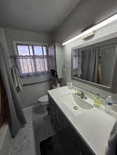 Bathroom with vanity and toilet