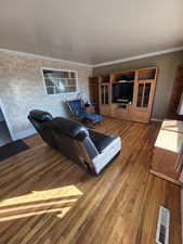 Living room with crown molding and dark hardwood / wood-style floors