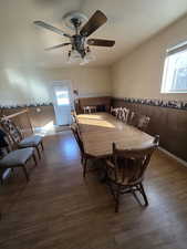 Dining area featuring ceiling fan and dark hardwood / wood-style flooring