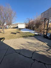 View of yard featuring a storage shed and a playground