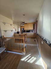 Interior space featuring tile patterned floors and ceiling fan