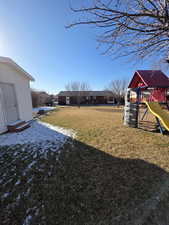 View of yard with a playground