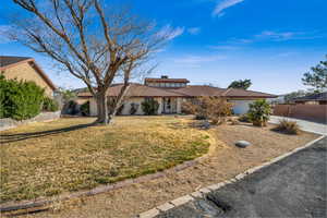 View of front of property with a front lawn