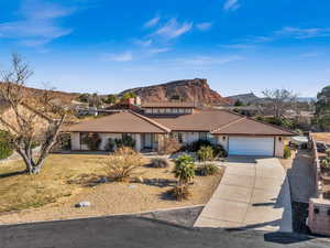 Ranch-style house featuring a mountain view and a garage