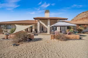 Back of house with a gazebo and a patio area